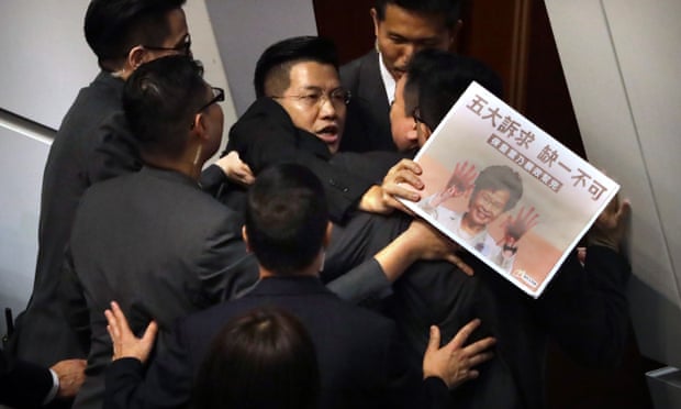 Chaos in Hong Kong chamber over violent attack on activist