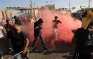 Iraqi security forces fire tear gas at protesters ahead of parliament session