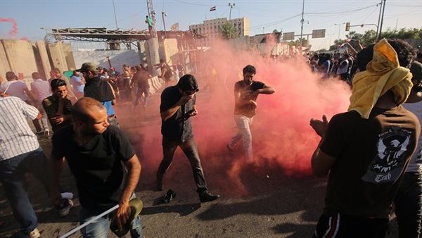 Iraqi security forces fire tear gas at protesters ahead of parliament session