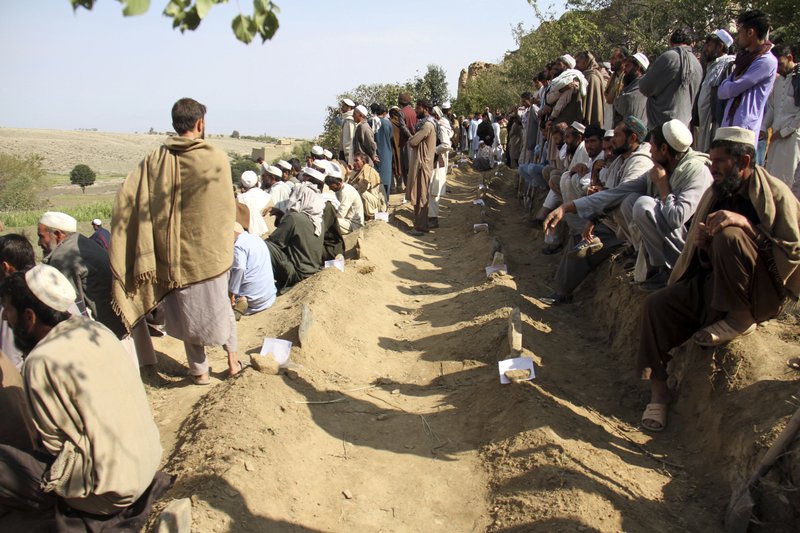 Afghan village buries its dead after mosque bombing kills 66