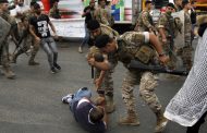 Lebanese army begins clearing road blocks as protesters refuse to leave
