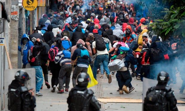 Three Colombian police killed in bomb blast as Bogotá protests flare again