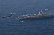 US aircraft carrier strike group sails through Strait of Hormuz