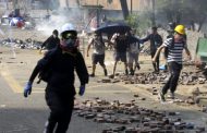 Hong Kong protest: police fire rounds of teargas at protesters trying to leave campus