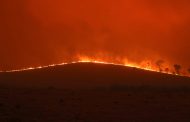 Australia fires: bushfires menace homes and lives and firefighters warn winds will create new threats