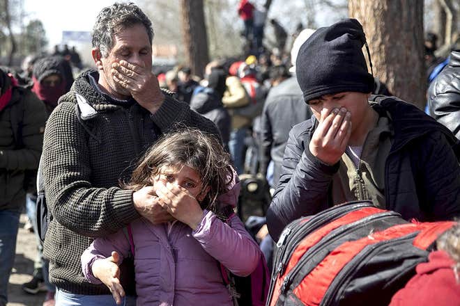 EU chief praises Greece as 'shield' of Europe after police attack refugees at border