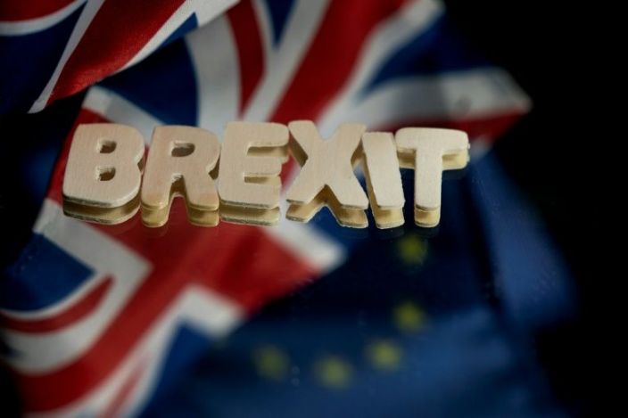EU leaders sign Brexit deal as British MPs debate