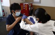Japan starts COVID-19 vaccinations with eye on Olympics