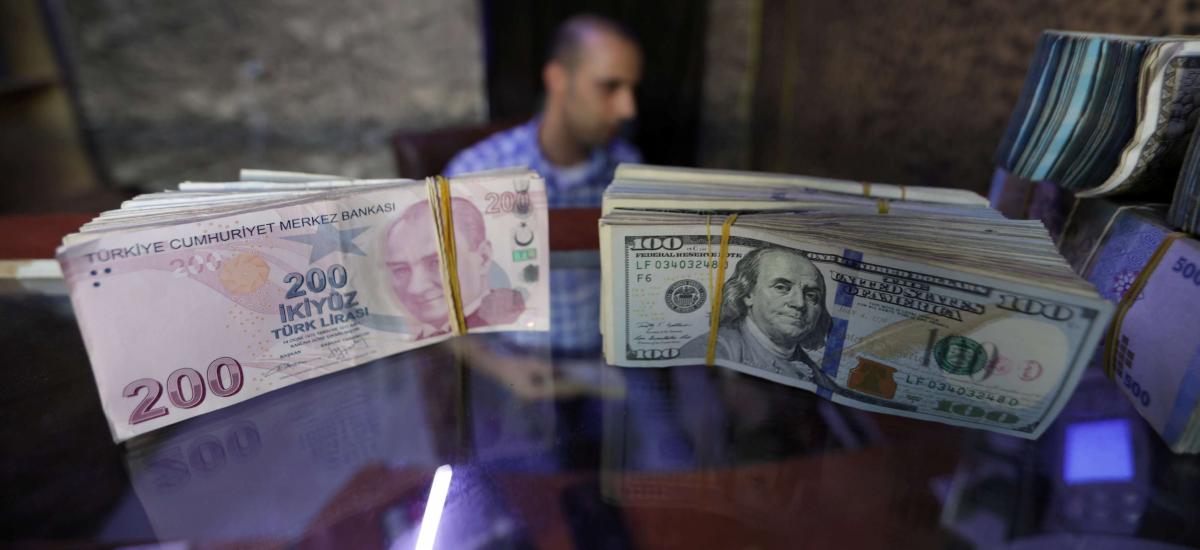 Turkish lira falls in volatile trading after central bank chief replaced