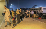 Rush of Afghan evacuees to Qatar leaves many crammed in hot hangar, facing an uncertain future