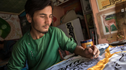 Business is good for Afghan artists — as long as they’re happy to paint Taliban flags and stamps