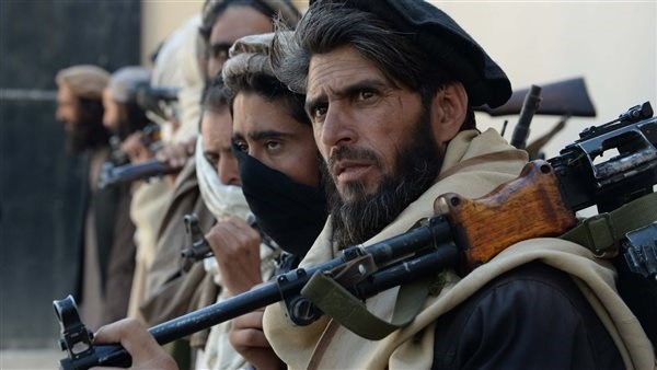 How do the Taliban's contradictory decisions support drug smuggling outside Afghanistan?
