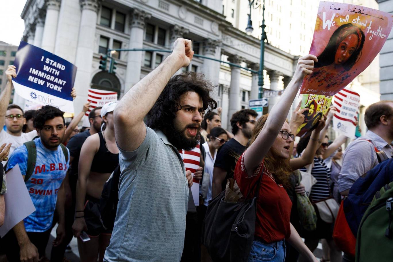 Protests against Trump’s restrictions on travel ban escalated, calling for re-uniting families and children   