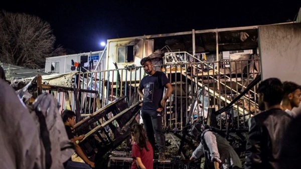 After deadly fire, Greece to move migrants from packed camps