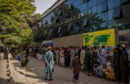 Glimpses of Kabul under the Taliban: Fighters patrolling roads, and lines at banks.