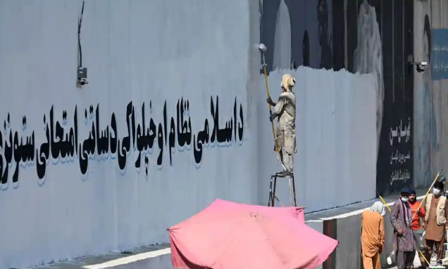 The soul of Kabul’: Taliban paint over murals with victory slogans