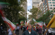 Protesters denounce the leaders of Brazil and Iran.