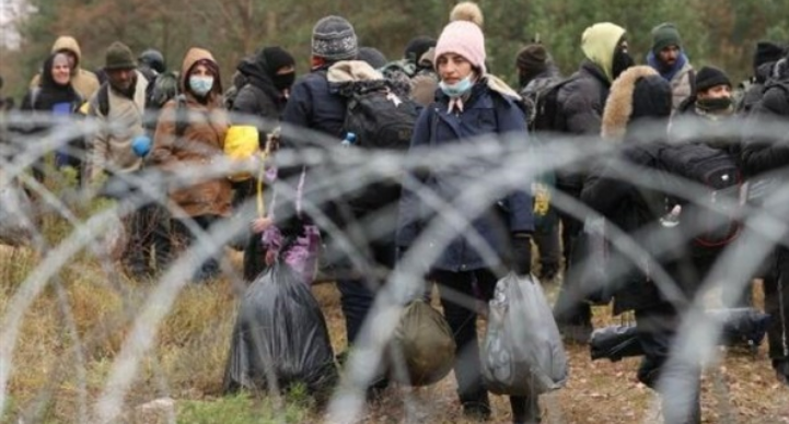 Belarus border crisis escalates with tear gas and water cannon fired at migrants