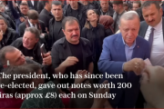 Erdogan caught on camera distributing money to voters at a polling station