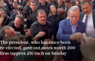 Erdogan caught on camera distributing money to voters at a polling station