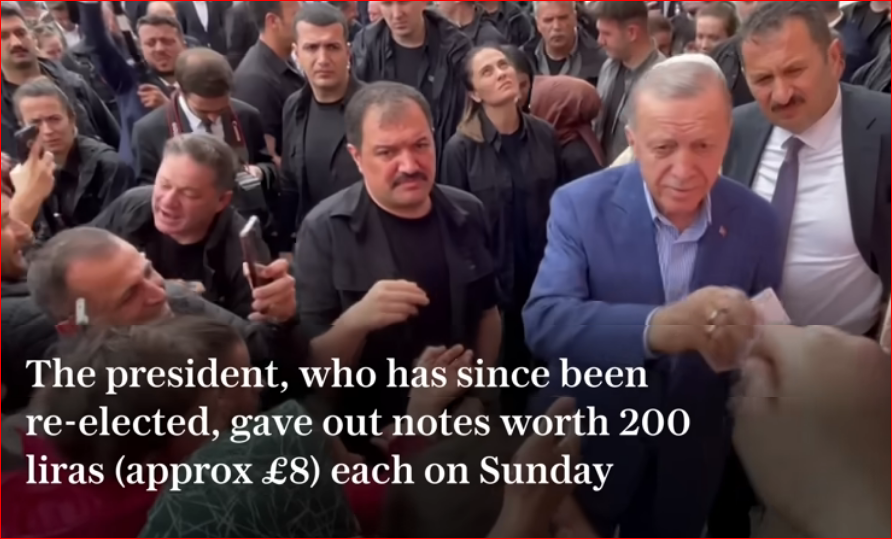 Erdogan caught on camera distributing money to voters at a polling station